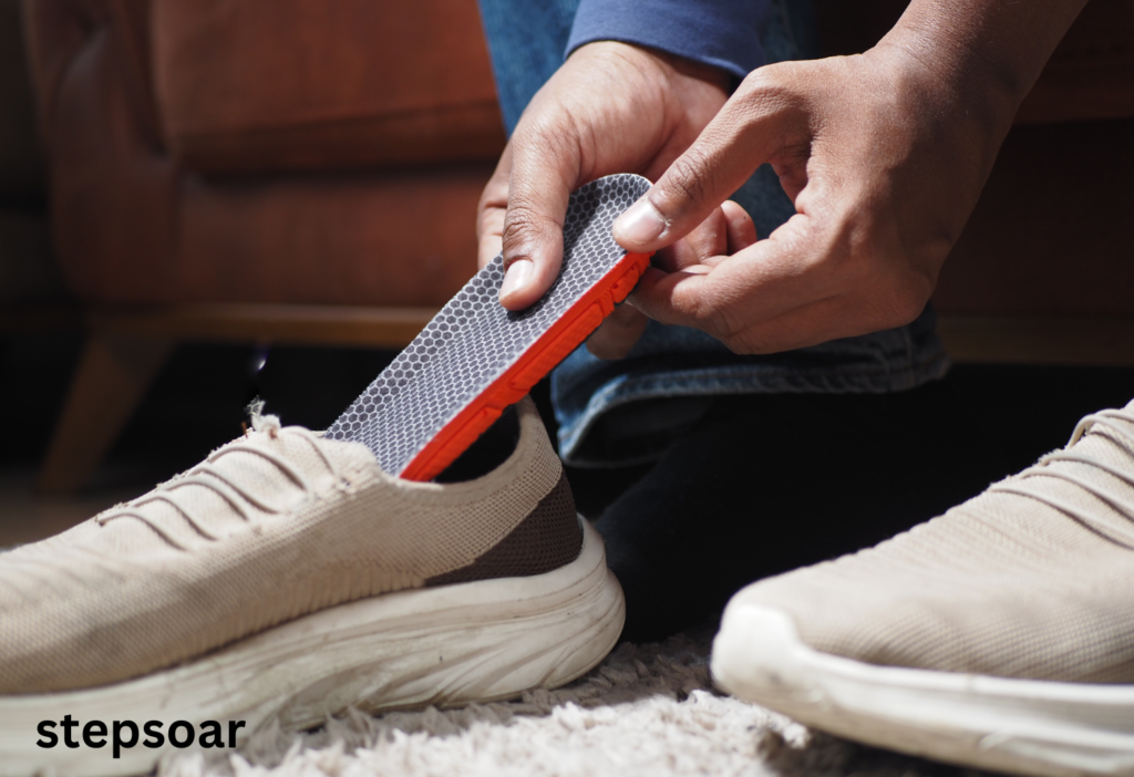 Birkenstock insoles fitted in casual shoes, providing arch support.